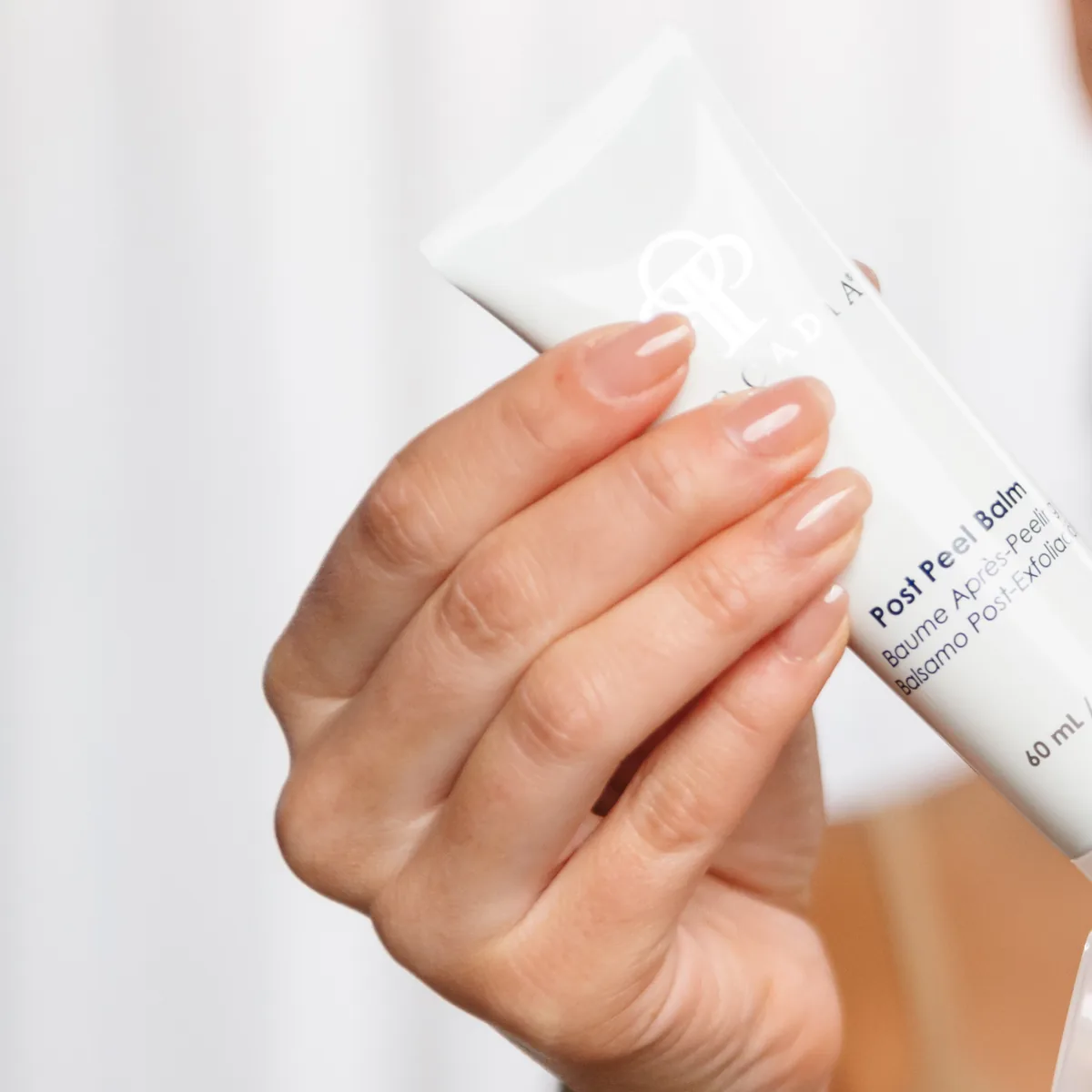 Post Treatment Balm by Circadia, held in hand