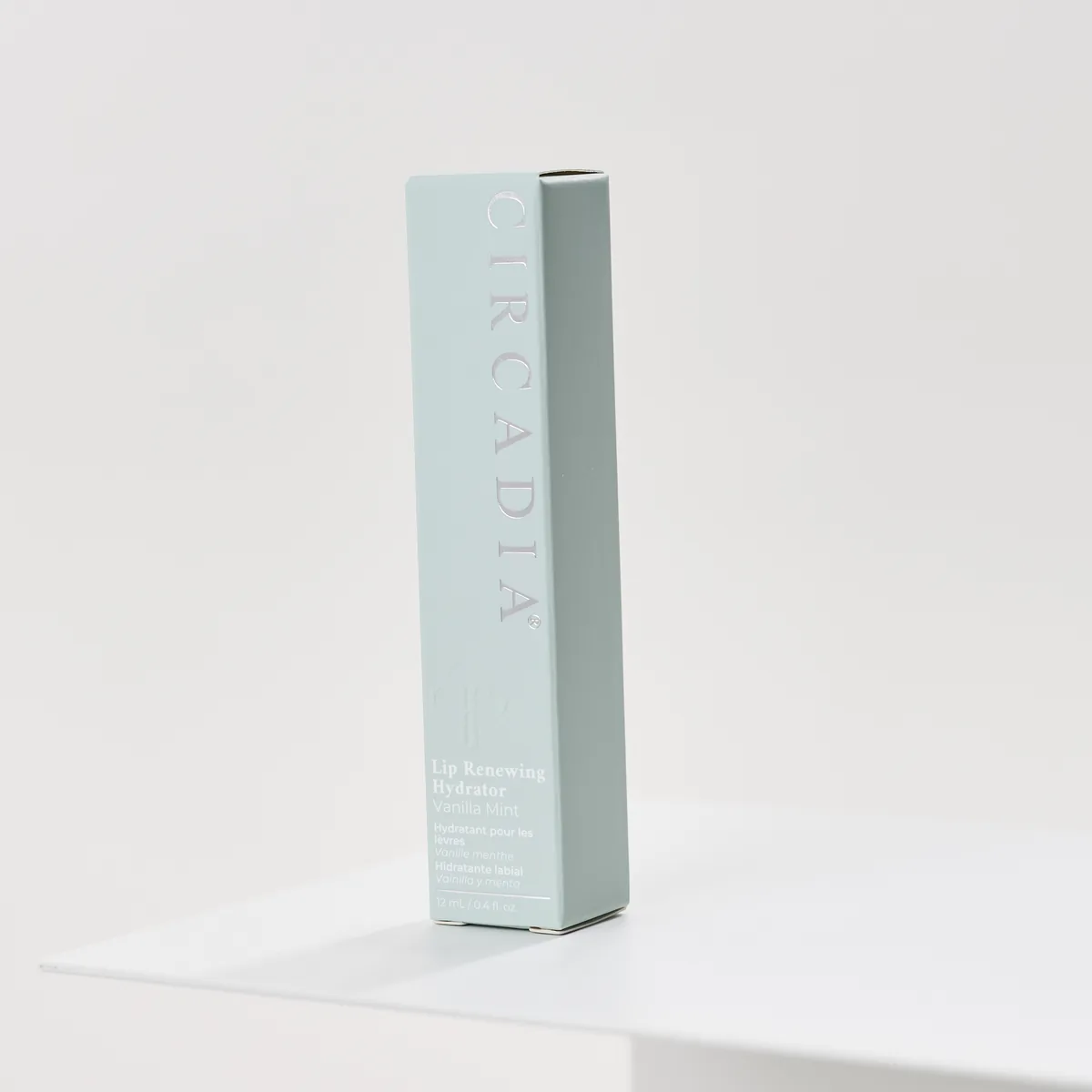 Lip Renewing Hydrator - Vanilla Mint by Circadia, box on a white pedestal