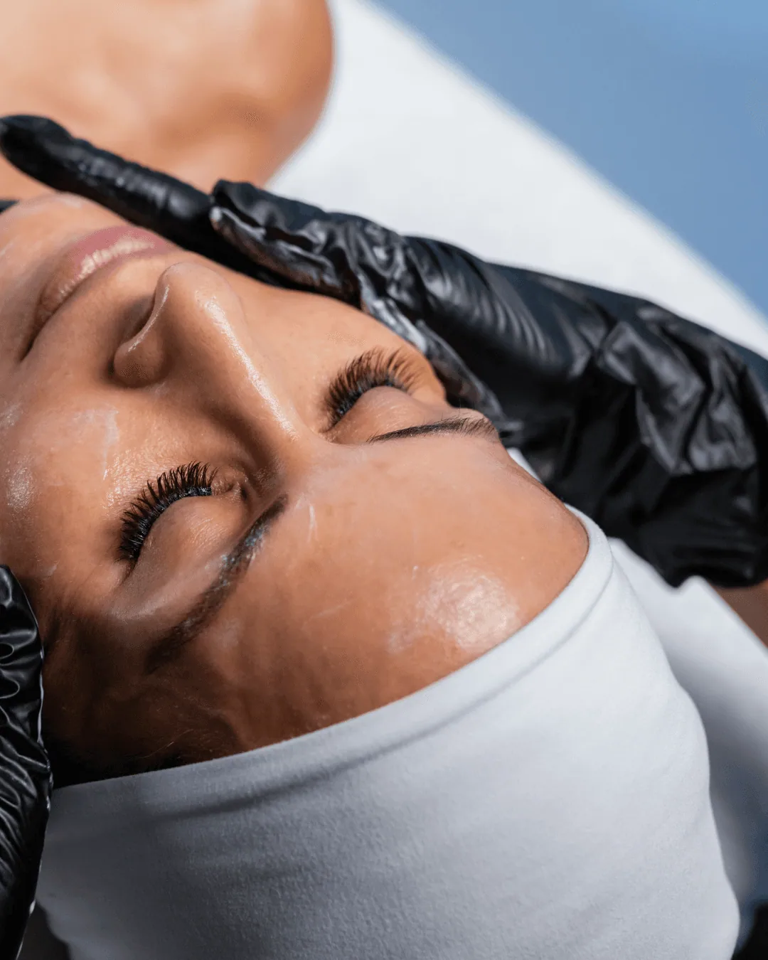 Client relaxing with eyes closed during a Circadia facial at KRIDO Wellness
