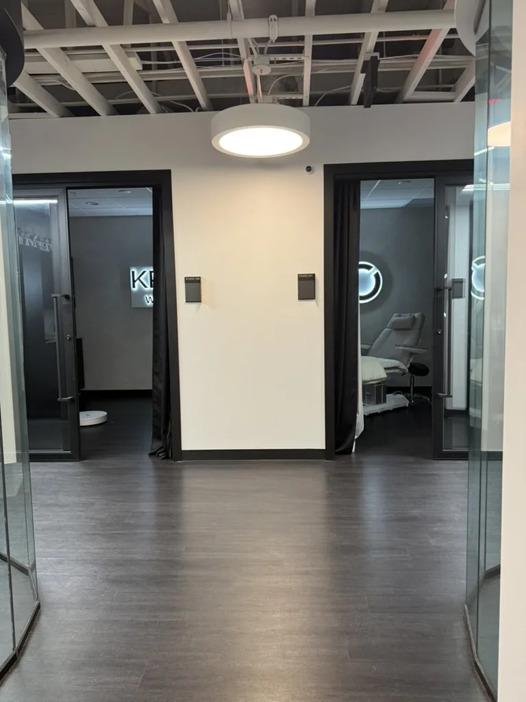 The hallway inside IMAGE Studios with the doors to KRIDO Wellness suites 220 and 221
