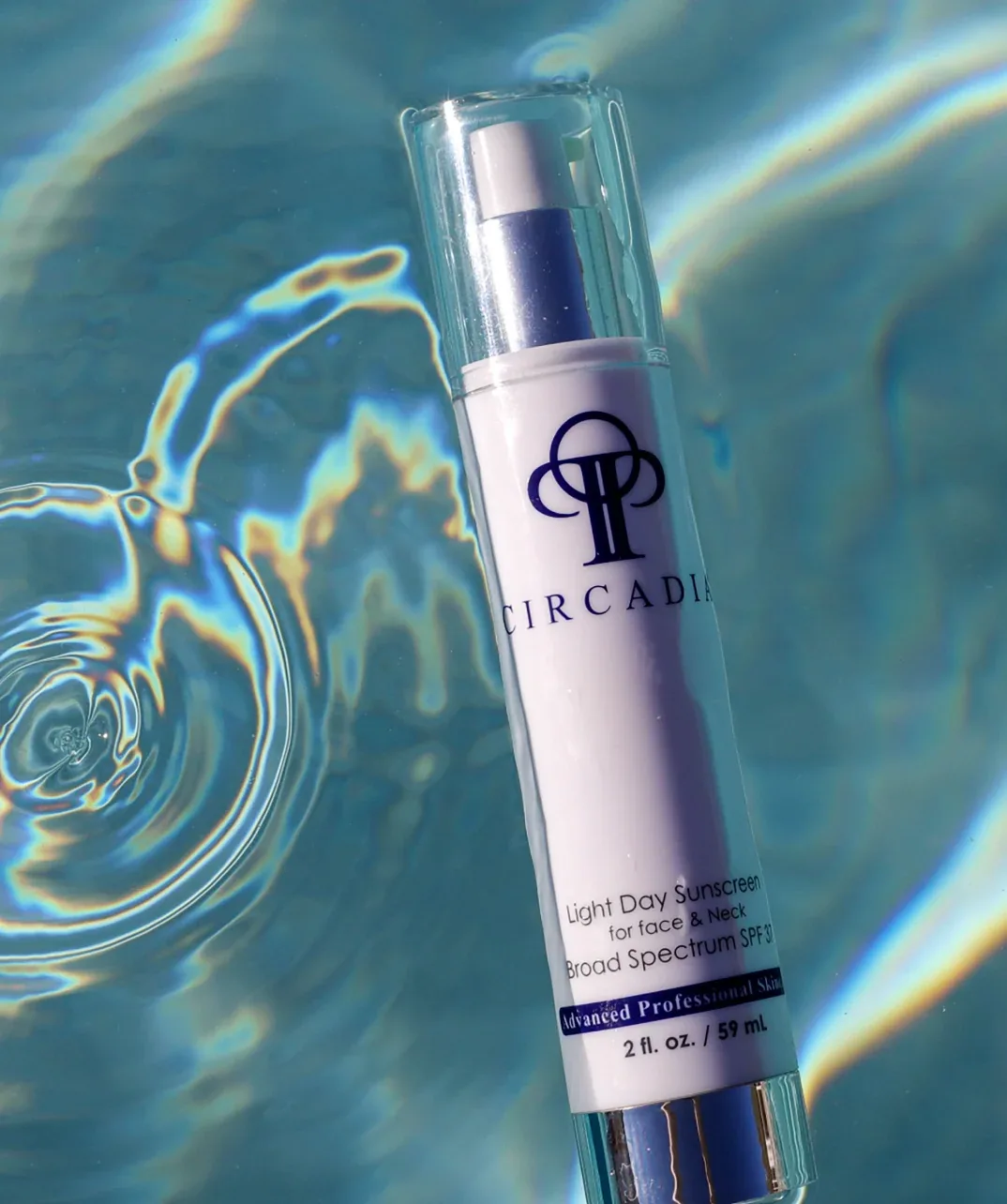 Circadia Light Day Sunscreen bottle in water — the professional line used at KRIDO Wellness